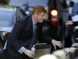 Former Penn State assistant football coach Mike McQueary enters the Dauphin County Courthouse, Monday, July 29, 2013, in Harrisburg, Pa. Graham Spanier, Gary Schultz and Timothy Curley are to go before a judge Monday to determine whether the three must face trial on charges they covered up an allegation that Jerry Sandusky was sexually preying on boys. (AP Photo/Matt Rourke)