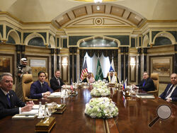 U.S. Secretary of State Marco Rubio, second left, meets with Saudi Foreign Minister Prince Faisal bin Farhan Al Saud, Saudi National Security Advisor Mosaad bin Mohammad Al-Aiban, U.S. National Security Advisor Mike Waltz, third left, U.S. Middle East envoy Steve Witkoff, left, Russian Foreign Minister Sergei Lavrov, right, and Russian President Vladimir Putin's foreign policy advisor Yuri Ushakov, second right, at Diriyah Palace, in Riyadh, Saudi Arabia, Tuesday Feb. 18, 2025. (Evelyn Hockstein/Pool Photo 