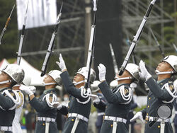 The military honor guard perform during the National Day celebrations in front of the Presidential Building in Taipei, Taiwan, Monday, Oct. 10, 2022. (AP Photo/Chiang Ying-ying)