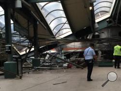 This Thursday, Sept. 29, 2016 photo provided by a passenger who was on the train when it crashed shows wreckage at the Hoboken, N.J. rail station. The commuter train barreled into the station during the morning rush hour, coming to a halt in a covered area between the station's indoor waiting area and the platform. (AP Photo)
