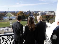 House Speaker Paul Ryan of Wis., left, shows President-elect Donald Trump, his wife Melania and Vice president-elect Mike Pence the view of the inaugural stand that is being built and Pennsylvania Avenue, from the Speaker's Balcony on Capitol Hill in Washington, Thursday, Nov. 10, 2016. (AP Photo/Alex Brandon)
