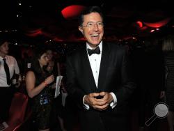 FILE - This Sept. 23, 2012 file photo shows TV personality Stephen Colbert at the 64th Primetime Emmy Awards Governors Ball in Los Angeles. (Photo by Chris Pizzello/Invision/AP, File)