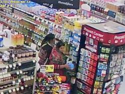 This Dec. 5, 2015 store surveillance video released by the Logan, Utah, Police Department shows women police say were shoplifting baby formula from a store in Logan. (Logan Police Department via AP)