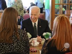 Making a stop at Terry's Diner in Moosic Monday March 17, 2014, Vice President Joe Biden talks with a group of individuals who are working in the community to sign up people for health care coverage before the Marketplace's March 31 enrollment deadline. (AP Photo/The Citizens' Voice, Mark Moran)