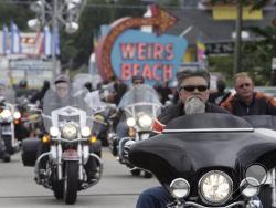 In this June 16, 2010 file photo, bikers arrive at Weirs Beach for bike week in Laconia, N.H. (AP Photo/Jim Cole, File)