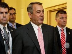 House Speaker John Boehner of Ohio, center, leaves a meeting with House Republicans on Capitol Hill in Washington, Friday, Sept. 25, 2015. In a stunning move, Boehner informed fellow Republicans on Friday that he would resign from Congress at the end of October, giving up his top leadership post and his seat in the House in the face of hardline conservative opposition. (AP Photo/Jacquelyn Martin)