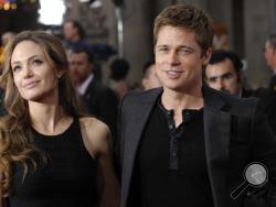 In this June 5, 2007 file photo, Brad Pitt, right, a cast member in the film "Ocean's Thirteen," arrives with Angelina Jolie at the premiere of the film at Grauman's Chinese Theatre in Los Angeles. Angelina Jolie Pitt has filed for divorce from Brad Pitt, bringing an end to one of the world's most star-studded, tabloid-generating romances. An attorney for Jolie Pitt, Robert Offer, said Tuesday, Sept. 20, 2016, that she has filed for the dissolution of the marriage. (AP Photo/Chris Pizzello, File)