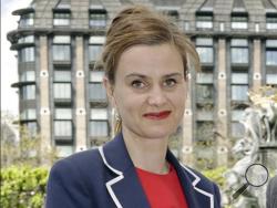 In this May 12, 2015 file photo, Labour Member of Parliament Jo Cox poses for a photograph. British lawmaker Cox has been injured in a shooting incident near Leeds, in West Yorkshire, England, it has been reported, Thursday June 16, 2016. (Yui Mok/PA via AP, File)