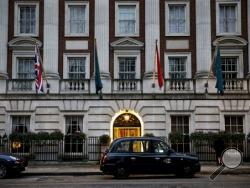 A taxi stops in front of the Millennium Hotel on Grosvenor Square in London, Thursday, Jan. 21, 2016. One day in 2006, former Russian spy Alexander Litvinenko, who claimed to know dark Kremlin secrets, had tea with two Russian men at the hotel. Three weeks later, he died of radioactive poisoning — after making a deathbed claim that Russian President Vladimir Putin had ordered his killing. (AP Photo/Matt Dunham)