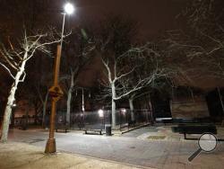 In this Jan. 14, 2016 file photo, new floodlight-style lighting illuminates Osborn Playground in the Brooklyn borough of New York. Prosecutors say they’ll ask a judge to dismiss charges against five teenage boys after a young woman who said she was gang-raped at the park in January 2016 recanted her accusation. (AP Photo/Kathy Willens, File)