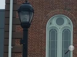 The Salem mayor sees a spooky face in this streetlamp.