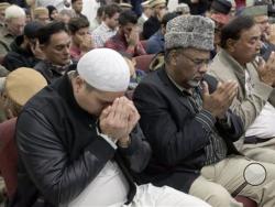 Muslim Community Prayer Vigil for San Bernadino shooting victims, in Chino, Calif., Thursday, Dec. 3, 2015. A husband and wife opened fire on a holiday banquet, killing multiple people on Wednesday. Hours later, the couple died in a shootout with police. (AP Photo/Nick Ut)
