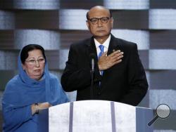  In this Thursday, July 28, 2016 file photo, Khizr Khan, father of fallen US Army Capt. Humayun S. M. Khan and his wife Ghazala speak during the final day of the Democratic National Convention in Philadelphia. (AP Photo/J. Scott Applewhite, File)