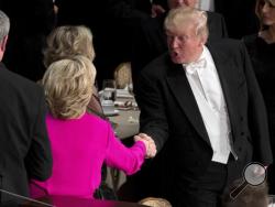 Republican presidential candidate Donald Trump, right, shakes hands with Democratic presidential candidate Hillary Clinton, left, at the conclusion of the 71st annual Alfred E. Smith Memorial Foundation Dinner, a charity gala organized by the Archdiocese of New York, Thursday, Oct. 20, 2016, at the Waldorf Astoria hotel in New York. (AP Photo/Andrew Harnik)
