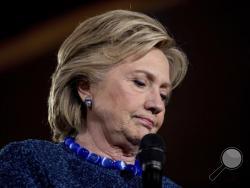 Democratic presidential candidate Hillary Clinton pauses while speaking at a rally at Theodore Roosevelt High School in Des Moines, Iowa, Friday, Oct. 28, 2016. (AP Photo/Andrew Harnik)