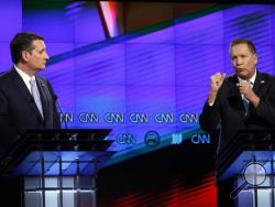 In this March 10, 2016, file photo, Republican presidential candidate Ohio Gov. John Kasich, right, speaks as Republican presidential candidate, Sen. Ted Cruz, R-Texas, listens, during a Republican presidential debate sponsored by CNN, Salem Media Group and the Washington Times at the University of Miami in Coral Gables, Fla. (AP Photo/Wilfredo Lee, File)