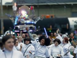 Members of the Krewe of Chewbacchus, a Mardi Gras Krewe, hold a parade with members dressed as Princess Leia, in honor of actress Carrie Fisher, who played Leia in the "Star Wars" movie series, in New Orleans, Friday, Dec. 30, 2016. Fisher died on Dec. 27, 2016, at the age of 60. (AP Photo/Gerald Herbert)