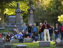In this Oct. 11, 2014 photo, actor Charles Brown portrays Peter Sommer, the founder of Keystone Steel, who lived between 1843 and 1920, as the Prairie Folklore Theatre performs during the Historic Springdale Cemetery Tour in Peoria, Ill. (AP Photo/Journal Star, Ron Johnson)