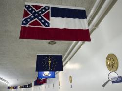 The Mississippi flag hangs, with the other state flags, in the subway between the U.S. Capitol and Dirksen Senate Office Building in Washington, Tuesday, June 23, 2015. In the wake of a massacre at a black church in Charleston, S.C., a bipartisan mix of officials across the country is calling for the removal of Confederate flags and other symbols of the Confederacy. Leaders of the Republican-controlled state of Mississippi are divided on whether to alter the state's flag, a corner of which is made up of the