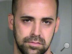 Daniel Bryant Gray, 31, was being booked into jail and charged with manslaughter and child abuse. Police say the father, whose infant son died after being left in a parked car in the Phoenix summertime heat on Wednesday Aug. 28, 2013, is suspected of smoking marijuana at the time. Police said earlier that 3-month-old Jamison Gray died after his father had gone to a sports bar where he works as a kitchen manager. (AP Photo/Maricopa County Sheriff’s Office)