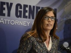 Pennsylvania Attorney Gen. Kathleen Kane addresses media over allegations of criminal activity by dozens of Catholic priests, Tuesday, March 1, 2016, in Altoona, Pa. (Darrell Sapp/Pittsburgh Post-Gazette via AP)