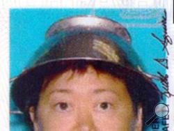 Asia Lemmon, whose legal name appears on her driver’s license as Jessica Steinhauser, is shown wearing a metal colander on her head on her Utah driver's license in this undated photo. Lemmon says the pasta strainer represents her beliefs in the Church of the Flying Spaghetti Monster and says state employees took the photo after she presented them with documents on religious freedom. (AP Photo/Utah Department of Motor Vehicles via The Spectrum)