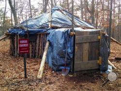 This March 23, 2015 photo shows the hut that Juniata College senior Dylan Miller built in the woods near campus in Huntingdon, Pa. (AP Photo/Michael Rubinkam)
