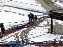 In this still image taken from video provided by Fox 31 Denver, police respond to reports of a shooting at Arapahoe High School in Centennial, Colo. Friday, Dec. 13, 2013. Colorado division of emergency management spokeswoman Micki Trost said her director went to the school and their weren't any more immediate details. (AP Photo/KDVR) 