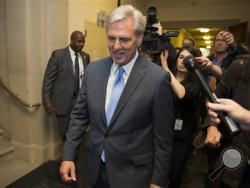 House Majority Leader of Kevin McCarthy of Calif. walks out of nomination vote meeting on Capitol Hill in Washington, Thursday, Oct. 8, 2015, after dropping out of the race to replace House Speaker John Boehner. (AP Photo/Evan Vucci)