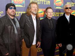 This Oct. 9, 2012 file photo shows, from left, Jason Bonham, son of the late Led Zeppelin drummer John Bonham; singer Robert Plant; bassist John Paul Jones; and guitarist Jimmy Page at the "Led Zeppelin: Celebration Day" premiere in New York. (Photo by Dario Cantatore/Invision/AP, File)