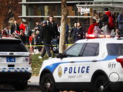 Students leave buildings surrounding Watts Hall as police respond to reports of a shooting on campus at Ohio State University, Monday, Nov. 28, 2016, in Columbus, Ohio. (AP Photo/John Minchillo)