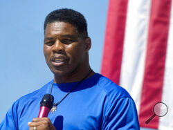 FILE - Georgia GOP Senate nominee Herschel Walker speaks during a campaign stop at Battle Lumber Co., Oct. 6, 2022, in Wadley, Ga. (AP Photo/Meg Kinnard, File)