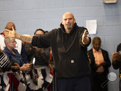 FILE—Pennsylvania Lt. Gov. John Fetterman, a Democratic candidate for U.S. Senate, meets with supporters as he leaves his event in Philadelphia, in this file photo from Sept. 24, 2022. Black voters are at the center of an increasingly competitive battle in a race that could tilt control of the Senate between Fetterman and Republican Mehmet Oz, as Democrats try to harness outrage over the Supreme Court's abortion decision and Republicans tap the national playbook to focus on rising crime in cities. (AP Photo