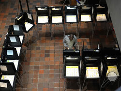 FILE - A person votes on the first day of early voting in the general election, Oct. 21, 2024, in Miami. (AP Photo/Lynne Sladky, File)