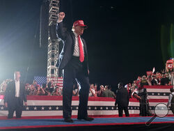 Republican presidential nominee former President Donald Trump gestures to the audience as he departs a campaign rally at the Calhoun Ranch, Saturday, Oct. 12, 2024, in Coachella, Calif. (AP Photo/Alex Brandon)