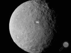 This Feb. 19, 2015 file image provided by NASA shows the dwarf planet Ceres, taken by the space agency's Dawn spacecraft from a distance of nearly 29,000 miles. (AP Photo/NASA/JPL-Caltech/UCLA/MPS/DLR/IDA, File)