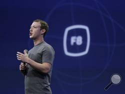 n this March 25, 2015, file photo, CEO Mark Zuckerberg gestures while delivering the keynote address at the Facebook F8 Developer Conference in San Francisco. (AP Photo/Eric Risberg, File)
