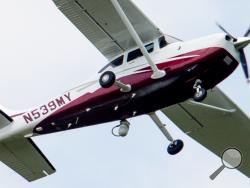 In this photo taken May 26, 2015, a small plane flies near Manassas Regional Airport in Manassas, Va. The plane is among a fleet of surveillance aircraft by the FBI, which are primarily used to target suspects under federal investigation. (AP Photo/Andrew Harnik)