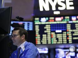 Traders work on the floor at the New York Stock Exchange in New York, Wednesday, July 8, 2015.