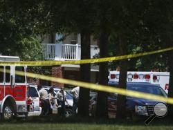 Shelby County Sheriff’s deputies work the scene where four young children were fatally stabbed at the Greens of Irene apartment, Friday, July 1, 2016 in Memphis, Tenn. Four young children were stabbed to death in a gated apartment complex in suburban Memphis on Friday, and police took their mother into custody for questioning. (Mark Weber/The Commercial Appeal via AP)