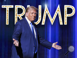 President-elect Donald Trump takes the stage before he speaks at the FOX Nation Patriot Awards, Thursday, Dec. 5, 2024, in Greenvale, N.Y. (AP Photo/Heather Khalifa)