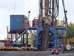  In this June 25, 2012 file photo, a crew works on a gas drilling rig at a well site for shale based natural gas in Zelienople, Pa. (AP Photo/Keith Srakocic, File)