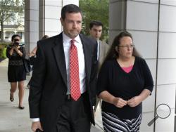 FILE - In this July 20, 2015 file photo, Rowan County Clerk Kim Davis, right, walks with her attorney Roger Gannam into the United States District Court for the Eastern District of Kentucky in Covington, Ky. (AP Photo/Timothy D. Easley, File)