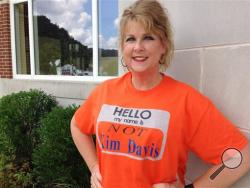 Kim Tabor, a clerk at the judicial center in Morehead, Ky., wears a T-shirt to work stating she is not Kim Davis, the Rowan County clerk, Wednesday Sept. 9, 2015. (AP Photo/ Dylan T. Lovan)