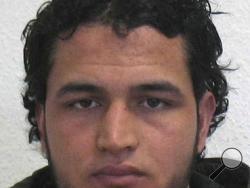 The wanted photo issued by German federal police on Wednesday, Dec. 21, 2016 shows 24-year-old Tunisian Anis Amri who is suspected of being involved in the fatal attack on the Christmas market in Berlin on Dec. 19, 2016. German authorities are offering a reward of up to 100,000 euros ($105,000) for the arrest of the Tunisian. (German police via AP)
