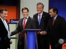 Republican presidential candidates (L-R) New Jersey Gov. Chris Christie, Sen. Marco Rubio, R-Fla., former Florida Gov. Jeb Bush and Sen. Ted Cruz, R-Texas, talk after the Republican presidential primary debate, Thursday, Jan. 28, 2016, in Des Moines, Iowa. (AP Photo/Charlie Neibergall)