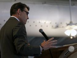 Republican presidential candidate former Texas Gov. Rick Perry speaks during the Eagle Council XLIV, sponsored by the Eagle Forum, at the Marriott St. Louis Airport in St. Louis, Friday, Sept. 11, 2015. During his speech Perry ended his second bid for the Republican presidential nomination. (Robert Cohen/St. Louis Post-Dispatch via AP) 