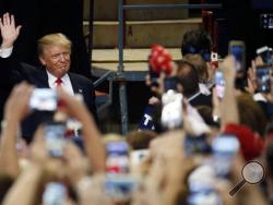 Republican presidential candidate Donald Trump arrives at a rally, Thursday, April 21, 2016, at the Pennsylvania Farm Show Complex and Expo Center in Harrisburg, Pa. (AP Photo/Julio Cortez)