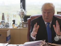 Republican presidential candidate Donald Trump gestures as he speaks during an interview with The Associated Press in his office at Trump Tower, Tuesday, May 10, 2016, in New York. (AP Photo/Mary Altaffer)