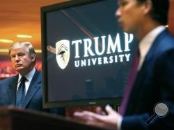  In this May 23, 2005, file photo, Donald Trump, left, listens as Michael Sexton introduces him at a news conference in New York where he announced the establishment of Trump University. (AP Photo/Bebeto Matthews, File)